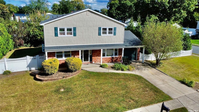 view of front of home featuring covered porch and a front lawn