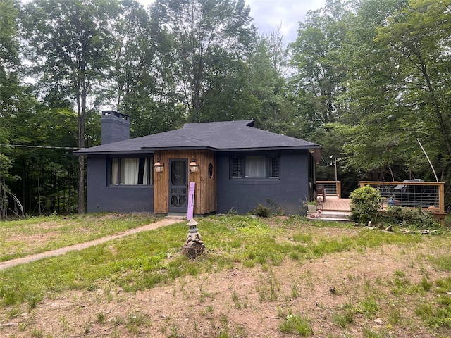 view of front of home with a wooden deck