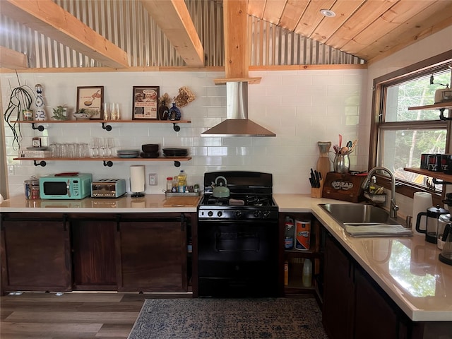 kitchen with gas stove, island range hood, vaulted ceiling, sink, and wooden ceiling