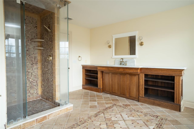 bathroom featuring vanity and a shower with shower door