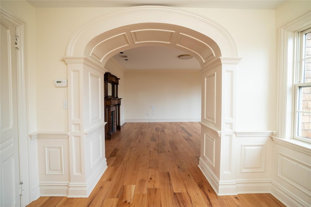 corridor with light hardwood / wood-style flooring