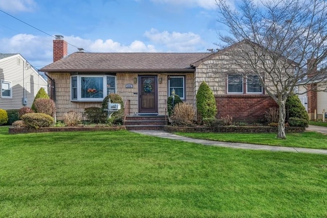 ranch-style house featuring a front yard