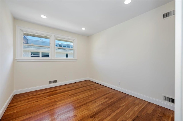 empty room featuring hardwood / wood-style flooring