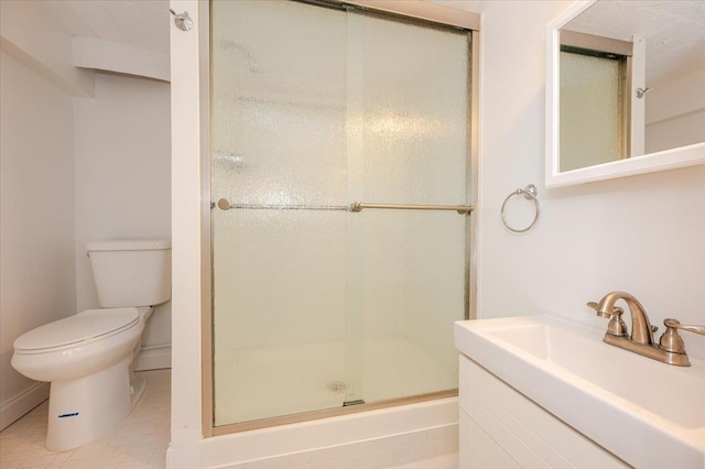 bathroom with vanity, toilet, and walk in shower