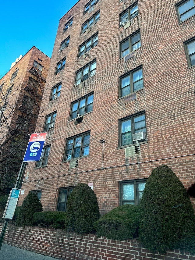 view of building exterior with cooling unit