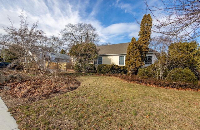 view of home's exterior with a lawn