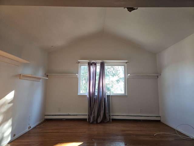 empty room with dark wood-type flooring, lofted ceiling, and a baseboard radiator