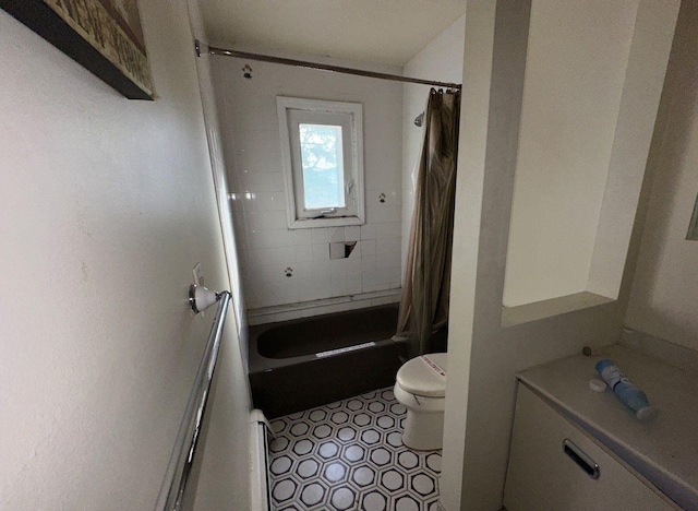 bathroom with tile patterned flooring, toilet, and shower / tub combo with curtain