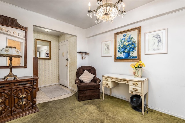 sitting room featuring carpet floors and an inviting chandelier