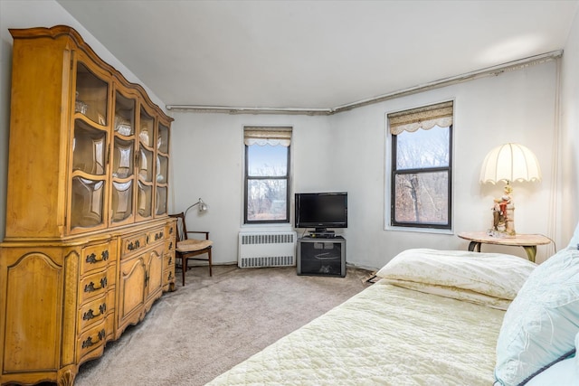 carpeted bedroom featuring radiator heating unit