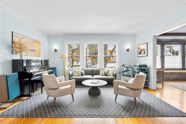 living room with crown molding and hardwood / wood-style floors