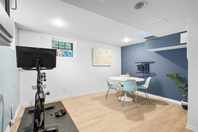 workout area featuring light hardwood / wood-style floors