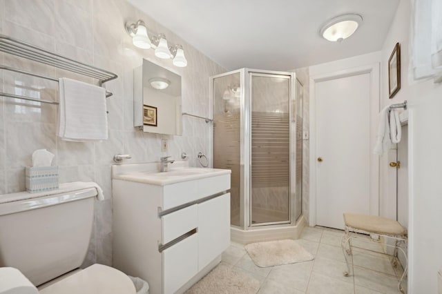 bathroom featuring vanity, toilet, tile patterned floors, and walk in shower