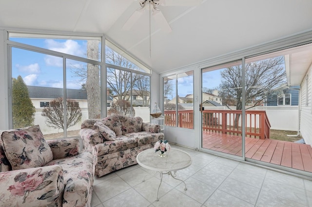 sunroom / solarium featuring lofted ceiling and ceiling fan