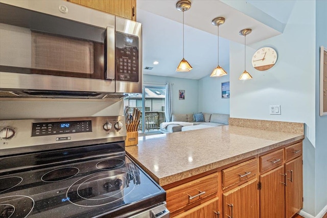 kitchen with lofted ceiling, light stone countertops, decorative light fixtures, kitchen peninsula, and stainless steel appliances