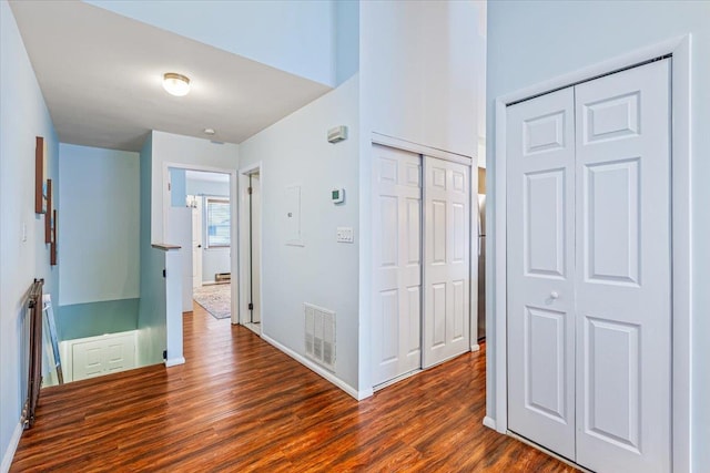 hallway featuring dark hardwood / wood-style floors