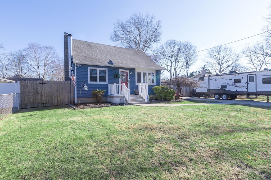 bungalow-style house with a front lawn