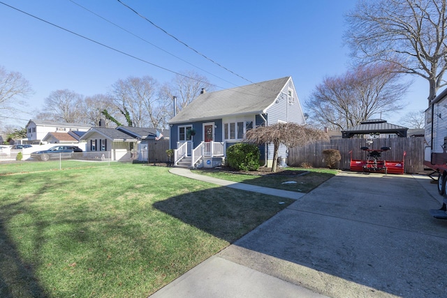 bungalow-style home with a front yard