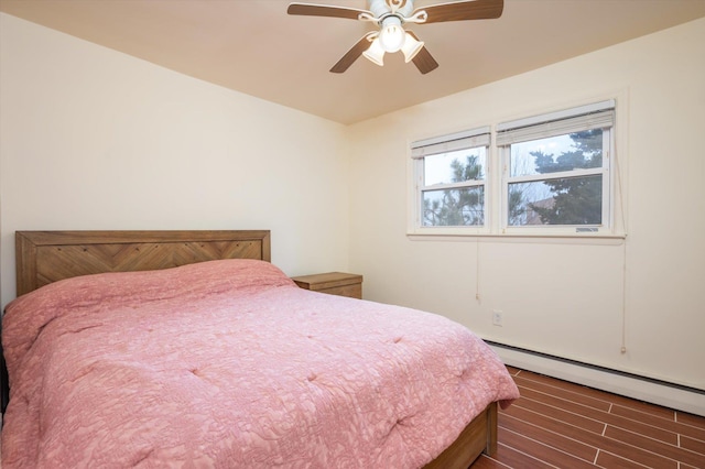 bedroom featuring baseboard heating and ceiling fan