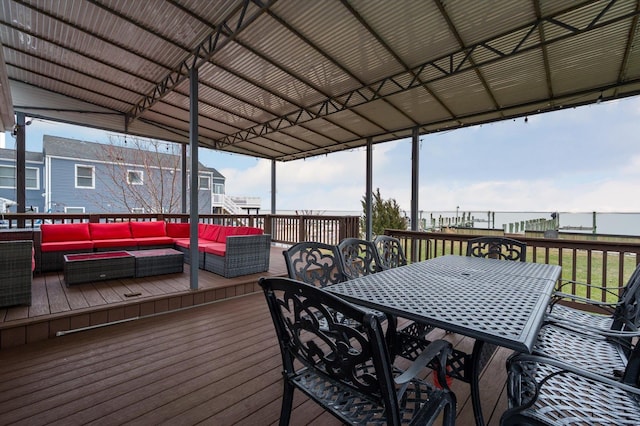 wooden deck with an outdoor living space