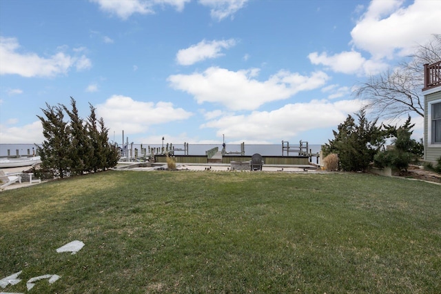 view of yard with a dock