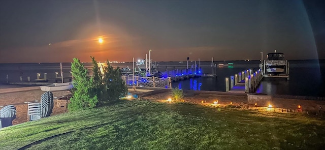 exterior space with a boat dock and a water view