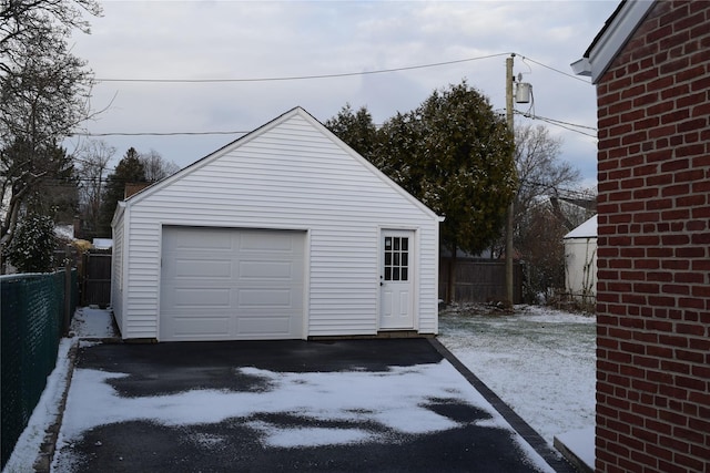 detached garage with fence