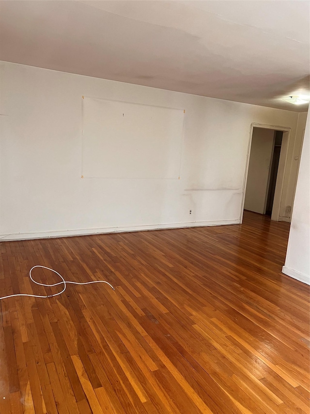 empty room with wood-type flooring