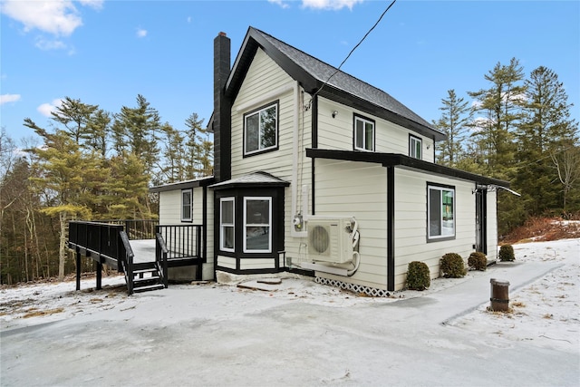 exterior space featuring ac unit and a deck