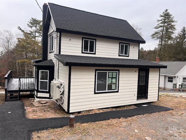 back of property with a deck and ac unit