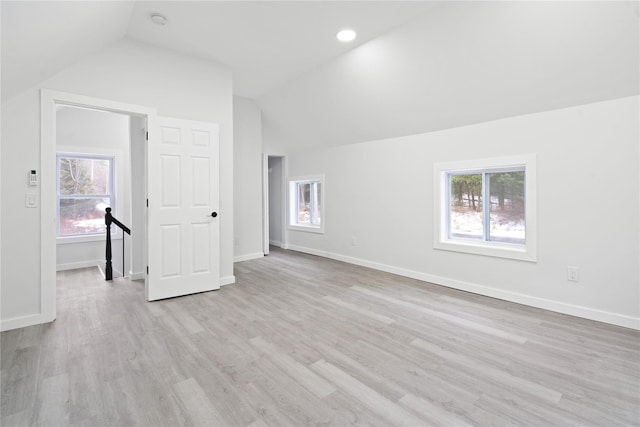 bonus room featuring lofted ceiling and light wood-type flooring