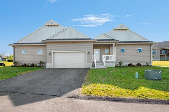 view of front facade with a garage and a front yard