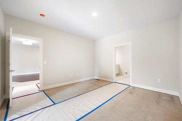 unfurnished bedroom featuring ensuite bath