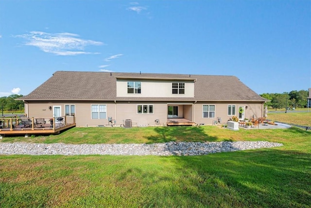 back of house featuring a lawn, cooling unit, and a deck