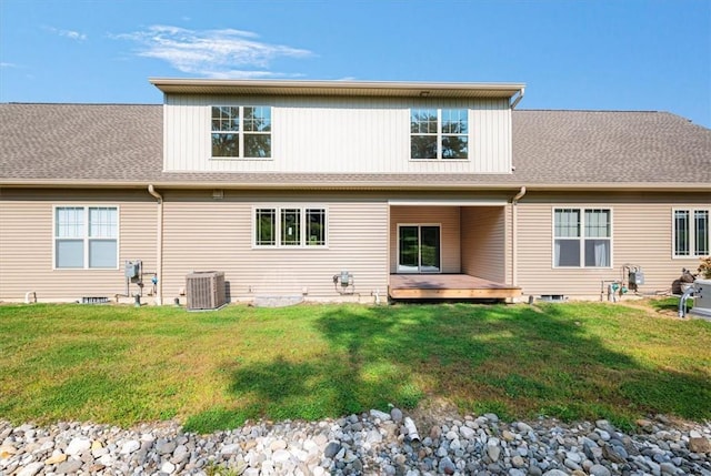 back of house with a yard, a wooden deck, and central AC