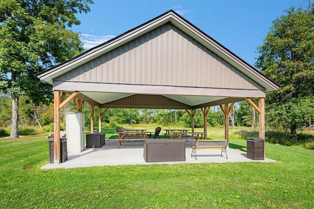 view of community featuring a gazebo, a patio area, and a lawn