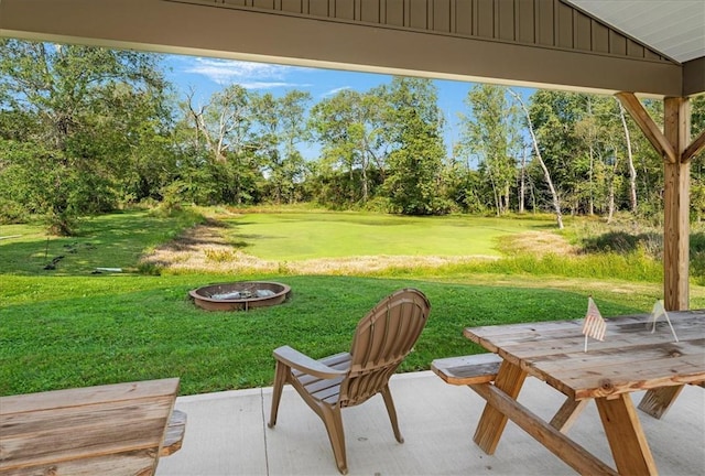 view of yard featuring a patio area and an outdoor fire pit