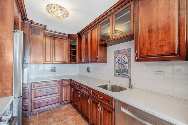 kitchen featuring decorative backsplash, stainless steel fridge with ice dispenser, and sink