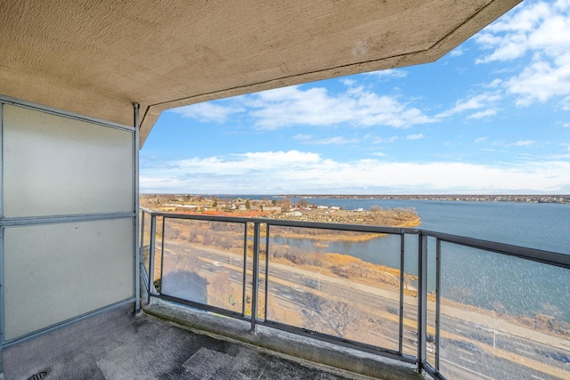 balcony featuring a water view