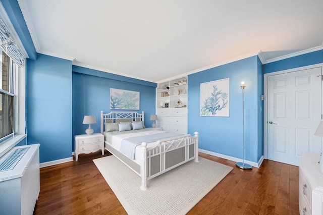 bedroom with dark hardwood / wood-style flooring and crown molding