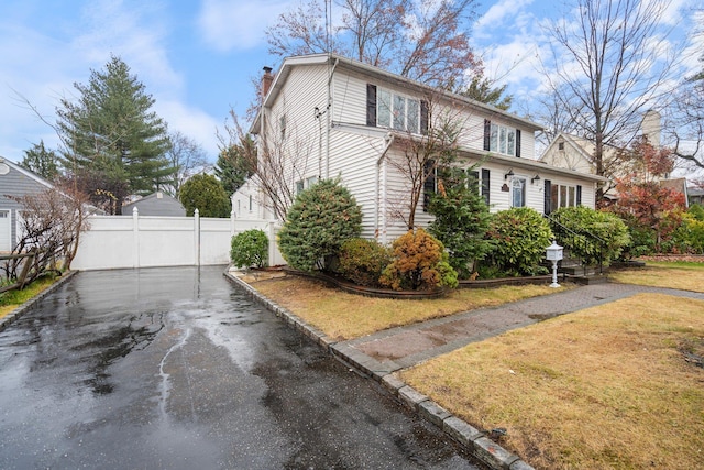 view of home's exterior with a yard