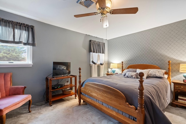 carpeted bedroom featuring ceiling fan