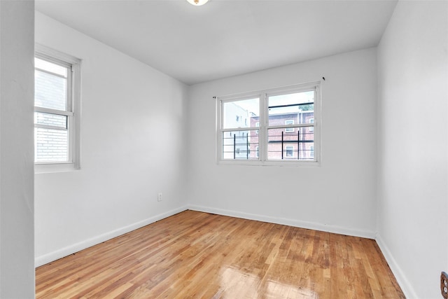 unfurnished room featuring light wood-type flooring