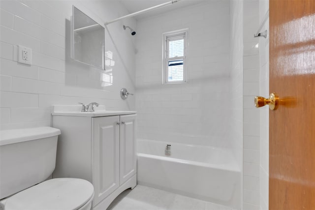 full bathroom with toilet, vanity, and tiled shower / bath combo