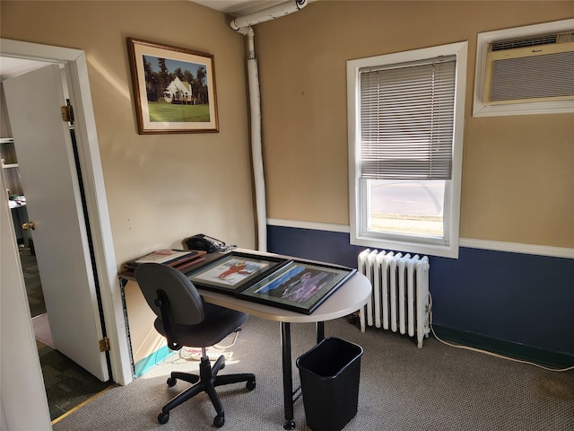 carpeted home office with radiator and a wall mounted air conditioner