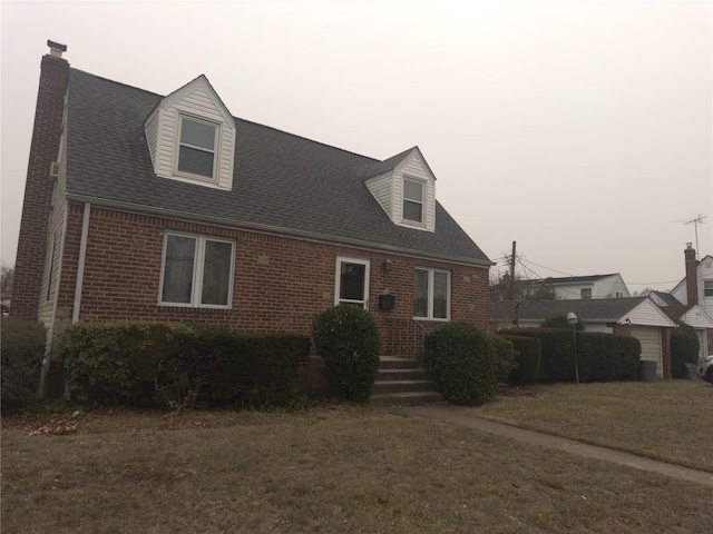 new england style home with a front yard