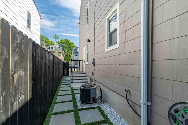 view of side of property featuring central AC unit