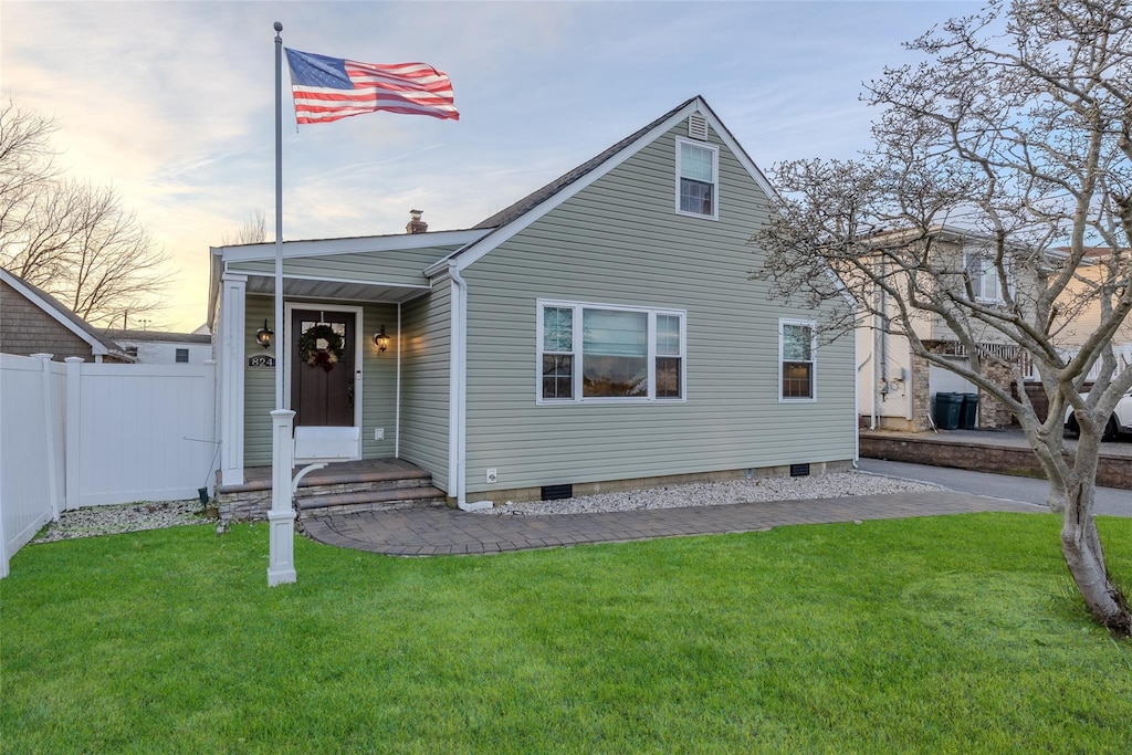 view of front of house with a lawn