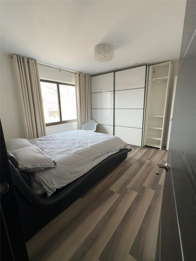 bedroom featuring hardwood / wood-style floors