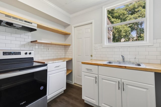 kitchen featuring wood counters, white cabinetry, stainless steel electric range oven, and sink